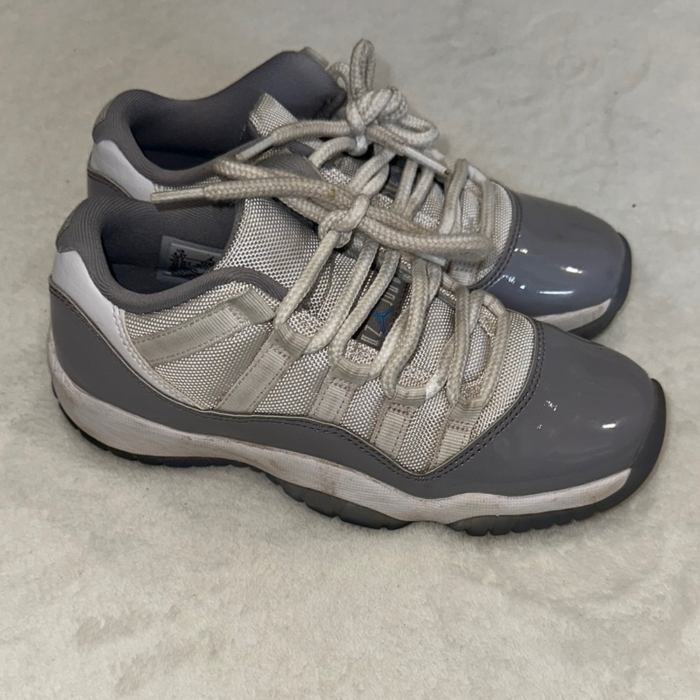 JORDAN 11 Retro Low Cement Gray and White Sneakers